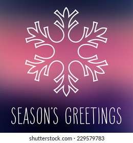 White snowflake over square abstract smooth blur background with hand written season's greetings.