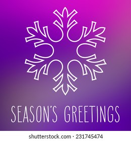 White snowflake over square abstract smooth blur background with hand written season's greetings.