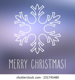 White snowflake over square abstract smooth blur background with hand written Christmas greetings.