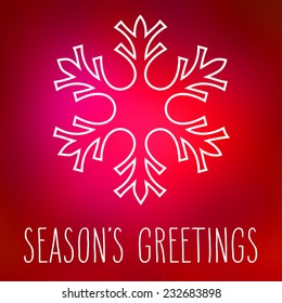 White snowflake over square abstract smooth blur background with hand written season's greetings.