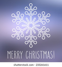 White snowflake over square abstract smooth blur background with hand written Christmas greetings.