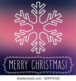 White snowflake over square abstract smooth blur background with hand written Christmas greetings in a frame.