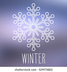 White snowflake over square abstract smooth blur background with hand word 'Winter'.