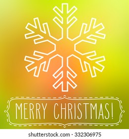 White snowflake over square abstract smooth blur background with hand written Christmas greetings in a frame.