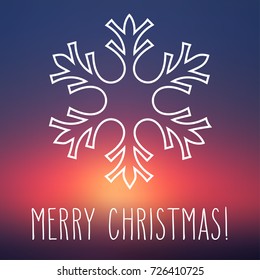 White snowflake over square abstract smooth blur background with hand written Christmas greetings.
