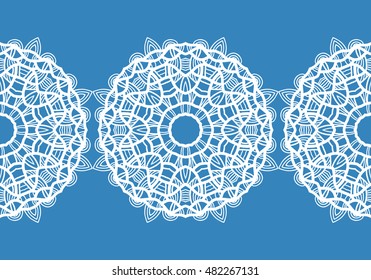 White snowflakes. Christmas pattern. Circular ornament and decorative lace. Vector