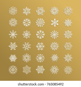 White snowflakes collection isolated on golden background. Snow icons, snow flakes silhouette. Element for christmas banner, cards