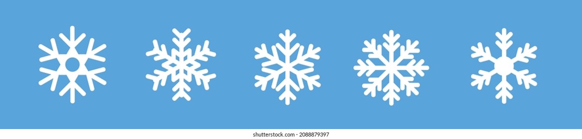Los iconos de copos de nieve blancos establecen el vector. Símbolos aislados de copos de nieve de invierno blanco sobre fondo azul. Silhouette navidad el símbolo de los copos de nieve. Ilustración vectorial.