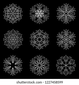 white snowflakes on black background. vector winter set. snowflakes collection. monochrome outliene