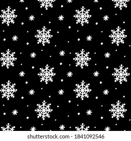 White snowflakes on black background. Great winter pattern for your design.