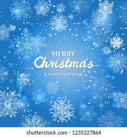 White snowflakes on blue background. Merry Christmas Greetings card