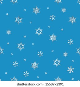 White snowflakes on a blue background. Seamless texture. Openwork patterns for Christmas and winter decor. Hand drawing. Doodle style. Christmas background.