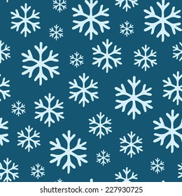 White  snowflakes on blue background seamless pattern