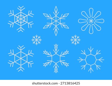 white snowflakes on blue background in various shapes and sizes