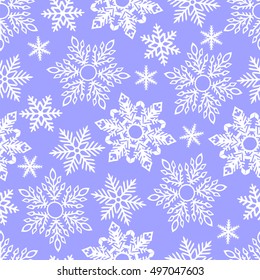 White snowflakes on a blue background. Seamless pattern.