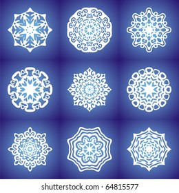 white snowflakes on blue background.