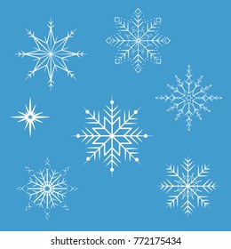 white snowflakes on a blue background