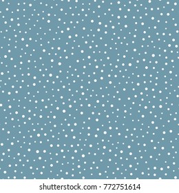 White snowflakes on a blue background. Seamless pattern