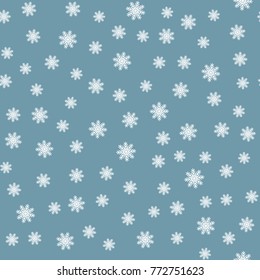 White snowflakes on a blue background. Seamless pattern