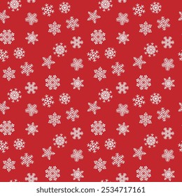 White snowflakes on a colored background of wrapping paper. Christmas holidays concept.