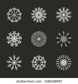 White snowflakes on dark gray background