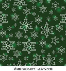 White snowflakes on green background. Seamless pattern. Vector.