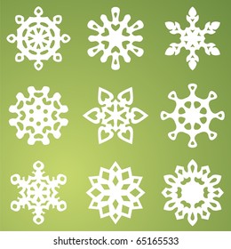 white snowflakes on green background. Vector illustration