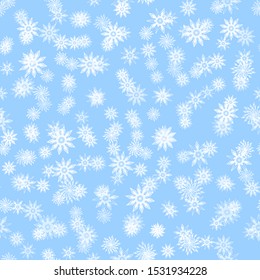 White snowflakes on a light blue background. New Year / Christmas seamless background / pattern 