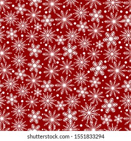 White snowflakes on red background seamless pattern for holiday design.