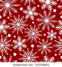 Copos de nieve blancos sobre fondo rojo sin costuras para el diseño de vacaciones.