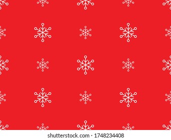 Weiße Schneeflocken auf rotem Hintergrund. Schleifpapier.