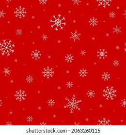 White snowflakes on red background seamless pattern. 
Christmas seamless pattern of falling snowflakes in white colors with bokeh effect. Cartoon flat style.