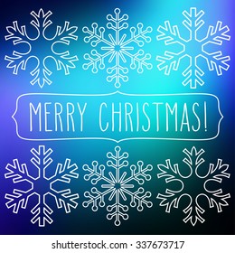 White snowflakes over blue square abstract smooth blur background with hand Christmas greetings in a frame.