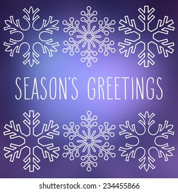 White snowflakes over square abstract smooth blur background with hand written season's greetings.