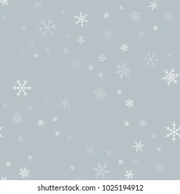 White snowflakes seamless pattern on light grey Christmas background.