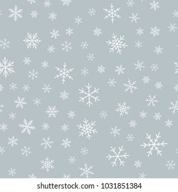 White snowflakes seamless pattern on light grey Christmas background.