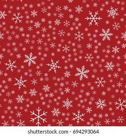 White snowflakes seamless pattern on red Christmas background.