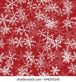 White snowflakes seamless pattern on red Christmas background.