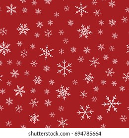 White snowflakes seamless pattern on red Christmas background.