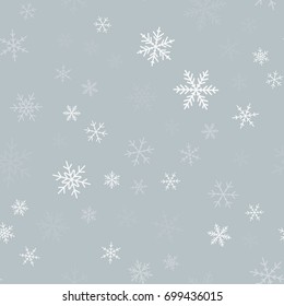 White snowflakes seamless pattern on light grey Christmas background.