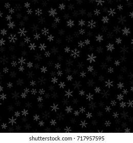 White snowflakes seamless pattern on black Christmas background.