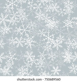 White snowflakes seamless pattern on light grey Christmas background.