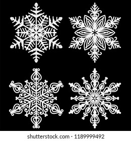 White Snowflakes - Set of 4 beautiful white snowflakes isolated on black background