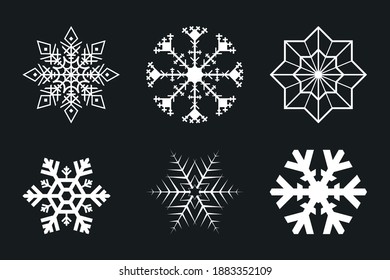 weiße Schneeflocken einzeln auf schwarzem Hintergrund