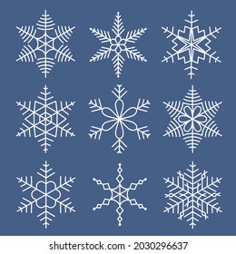 White snowflakes set isolated on blue background. Snow elements for Christmas holidays. Icy objects for greeting card decoration. Cool design vector illustration.