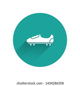 White Soccer or football shoes with spikes icon isolated with long shadow. American football boot. Green circle button. Vector Illustration
