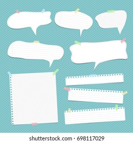 White speech bubbles, note, copybook, notebook paper with dashed line stuck on blue background.