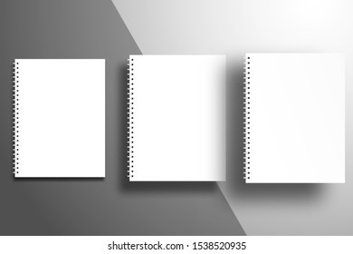 White spiral notebooks at different heights from the surface with diagonal gray sheets. Template for design with realistic shadows