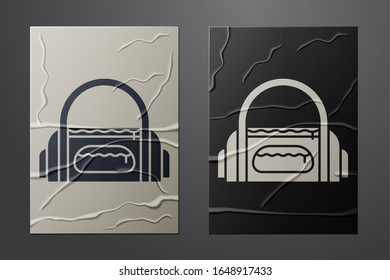 White Sport bag icon isolated on crumpled paper background. Paper art style. Vector Illustration