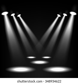 White spotlights shining in dark place background